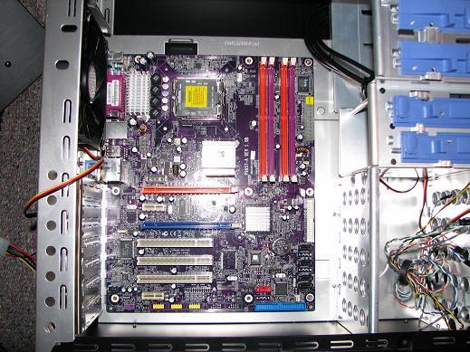 Set The Motherboard Into Place And Secure With One Upper Right Screw And One Lower Right Screw